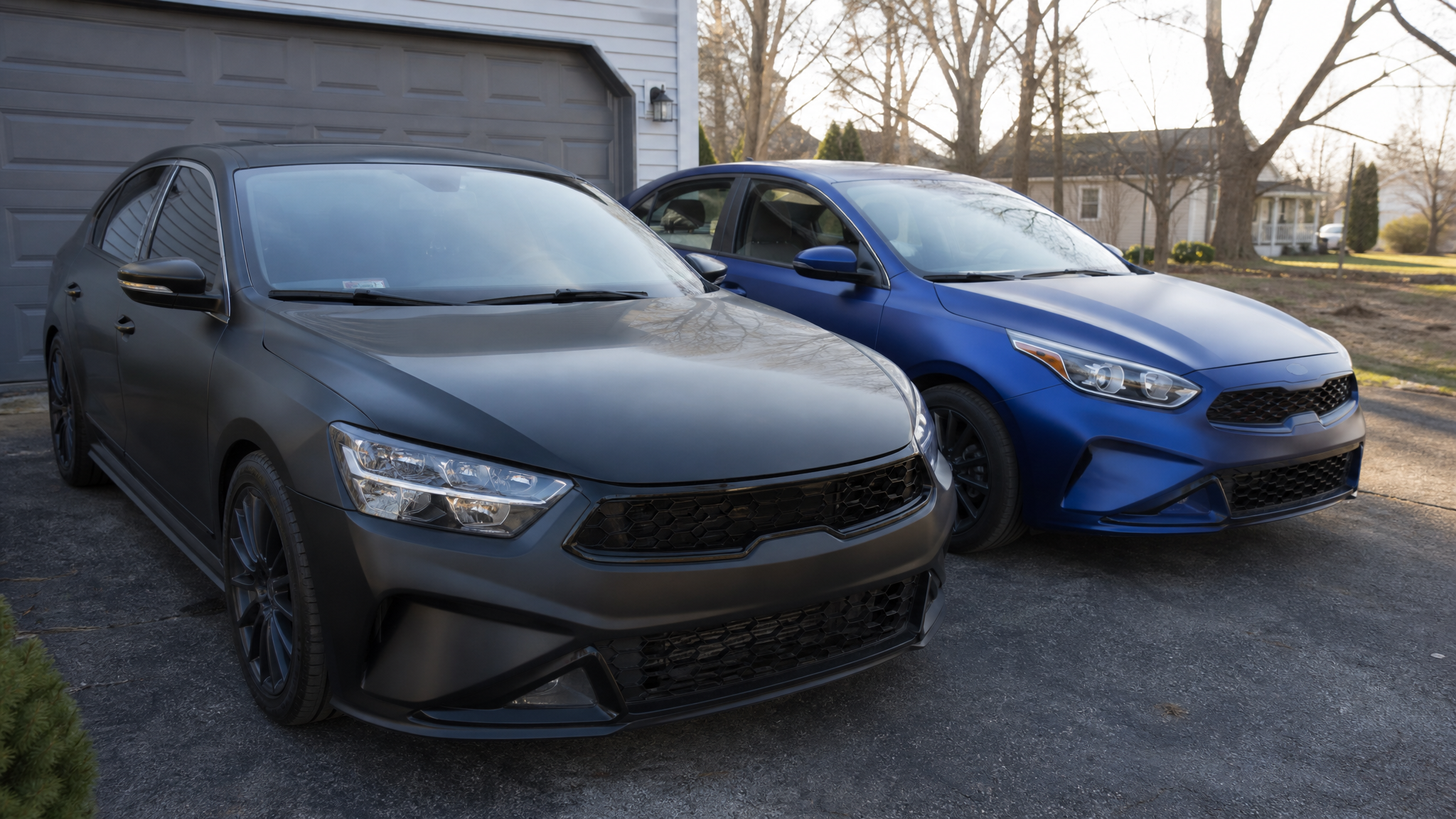 Matte and satin wrapped daily driver cars in natural daylight