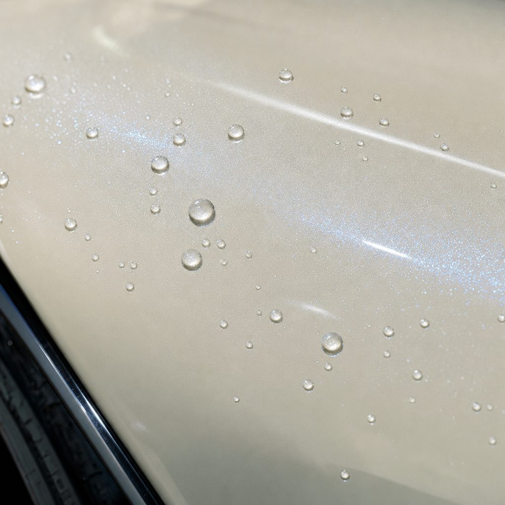 Close-up of Color Shift Diamond Blue White gloss colored PPF surface texture | Veloro