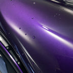 Close-up of Bright Black Purple gloss colored PPF surface texture | Veloro