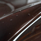 Close-up of Brocade Red gloss colored PPF surface texture | Veloro