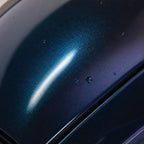 Close-up of Diamond Aurora Green gloss colored PPF surface texture | Veloro