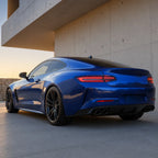 Luxury car wrapped in Diamond Blue gloss colored PPF at golden hour | Veloro