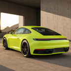 Luxury car wrapped in Fluorescent Neon Yellow gloss colored PPF at golden hour | Veloro
