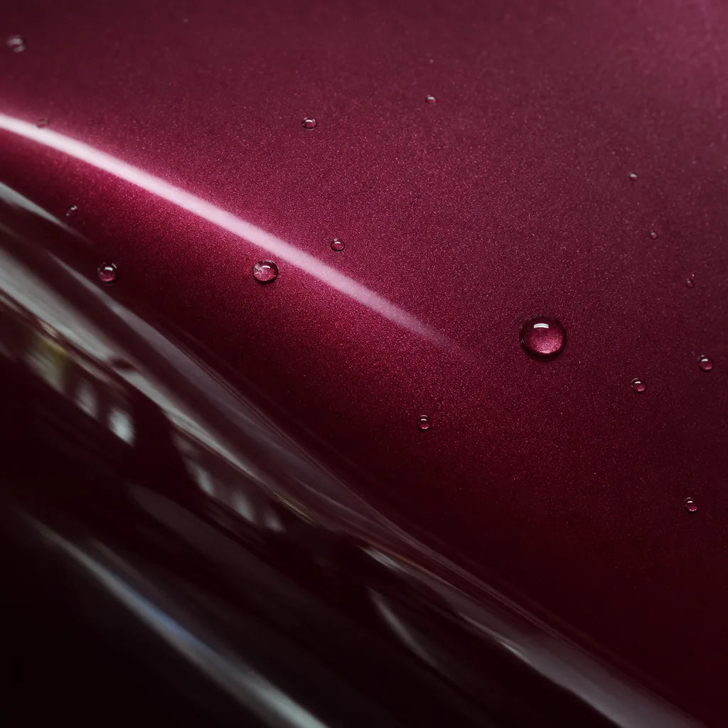 Close-up of Glazed Tata Red gloss colored PPF surface texture | Veloro