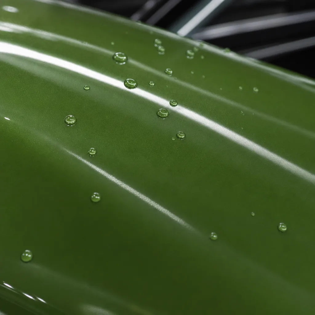 Close-up of Light Racing Green gloss colored PPF surface texture | Veloro