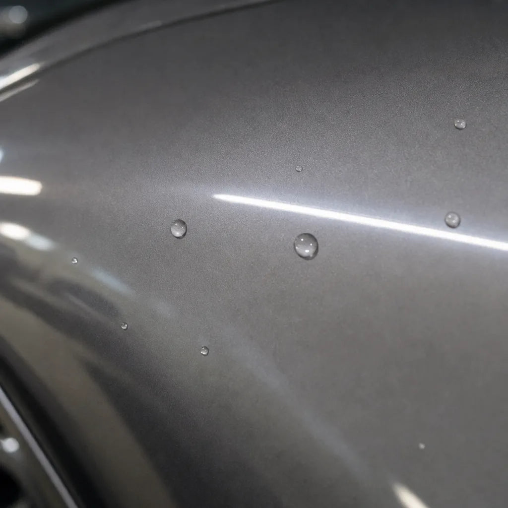Close-up of Liquid Dark Silver gloss colored PPF surface texture | Veloro