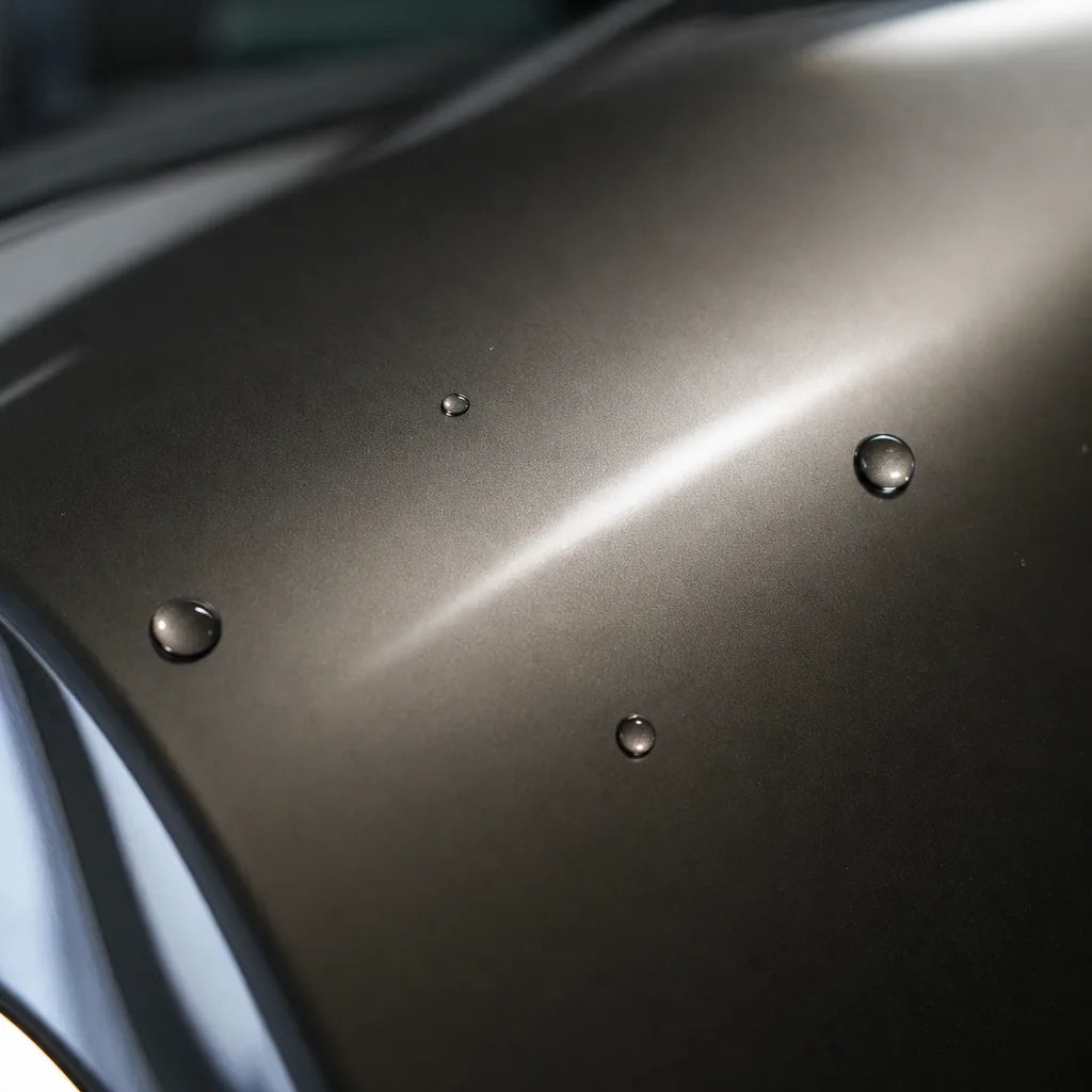 Close-up of Liquid Metallic Bronze gloss colored PPF surface texture | Veloro