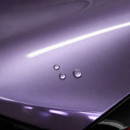 Close-up of Liquid Metallic Jedi Pink gloss colored PPF surface texture | Veloro