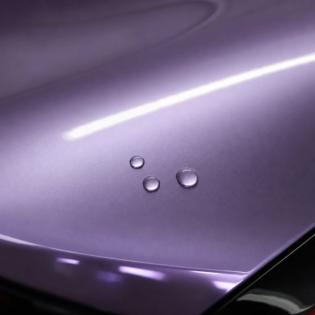 Close-up of Liquid Metallic Jedi Pink gloss colored PPF surface texture | Veloro