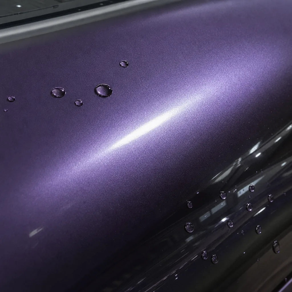 Close-up of Liquid Metallic Loganberry gloss colored PPF surface texture | Veloro