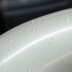 Close-up of Liquid Metallic Mousse White gloss colored PPF surface texture | Veloro