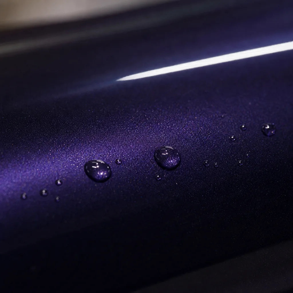Close-up of Liquid Metallic Purple gloss colored PPF surface texture | Veloro