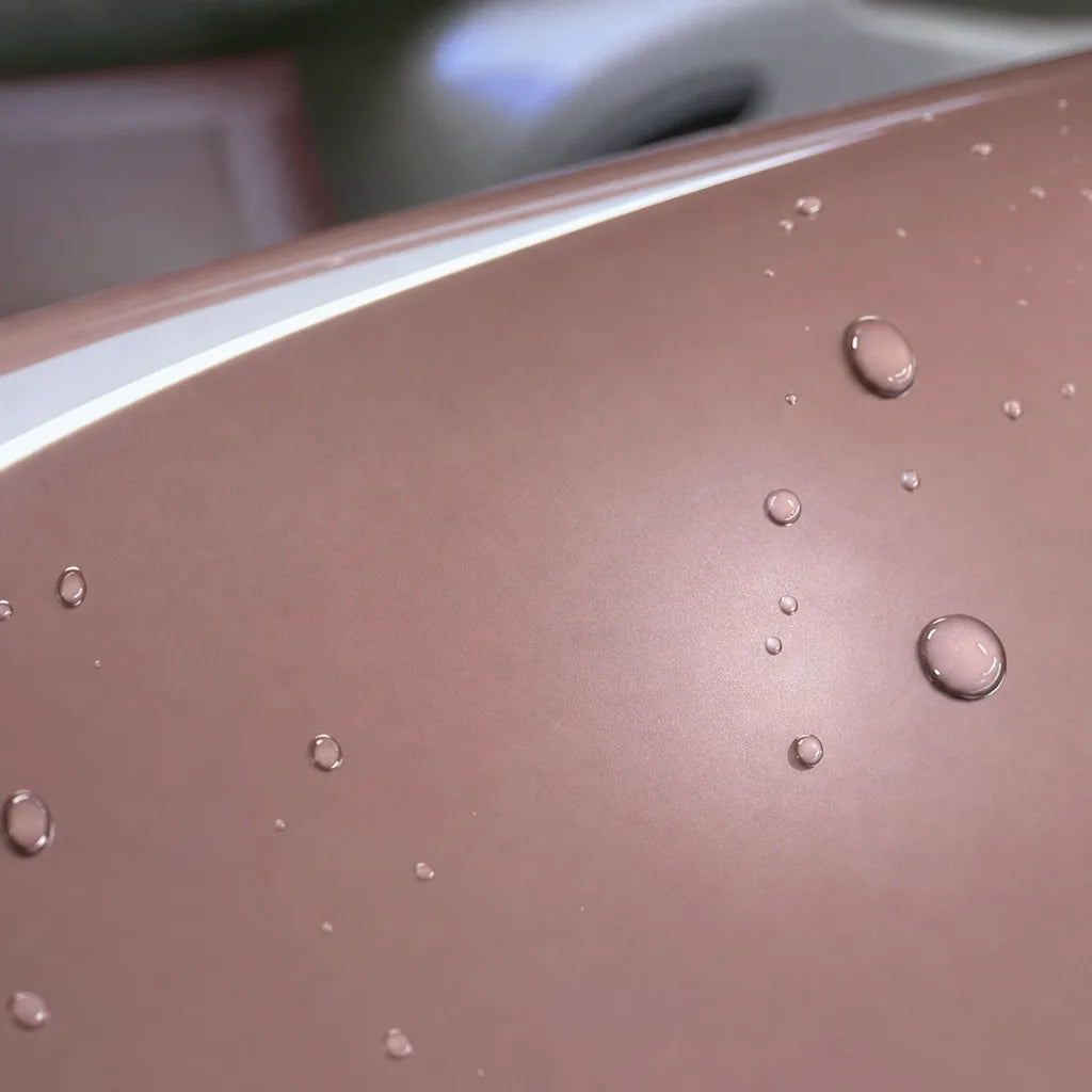 Close-up of Liquid Metallic Shell Pink gloss colored PPF surface texture | Veloro