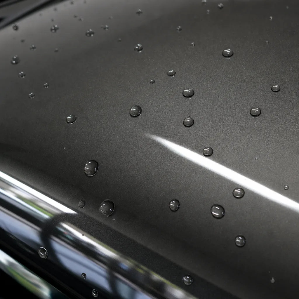 Close-up of Liquid Metallic Titanium Grey gloss colored PPF surface texture | Veloro