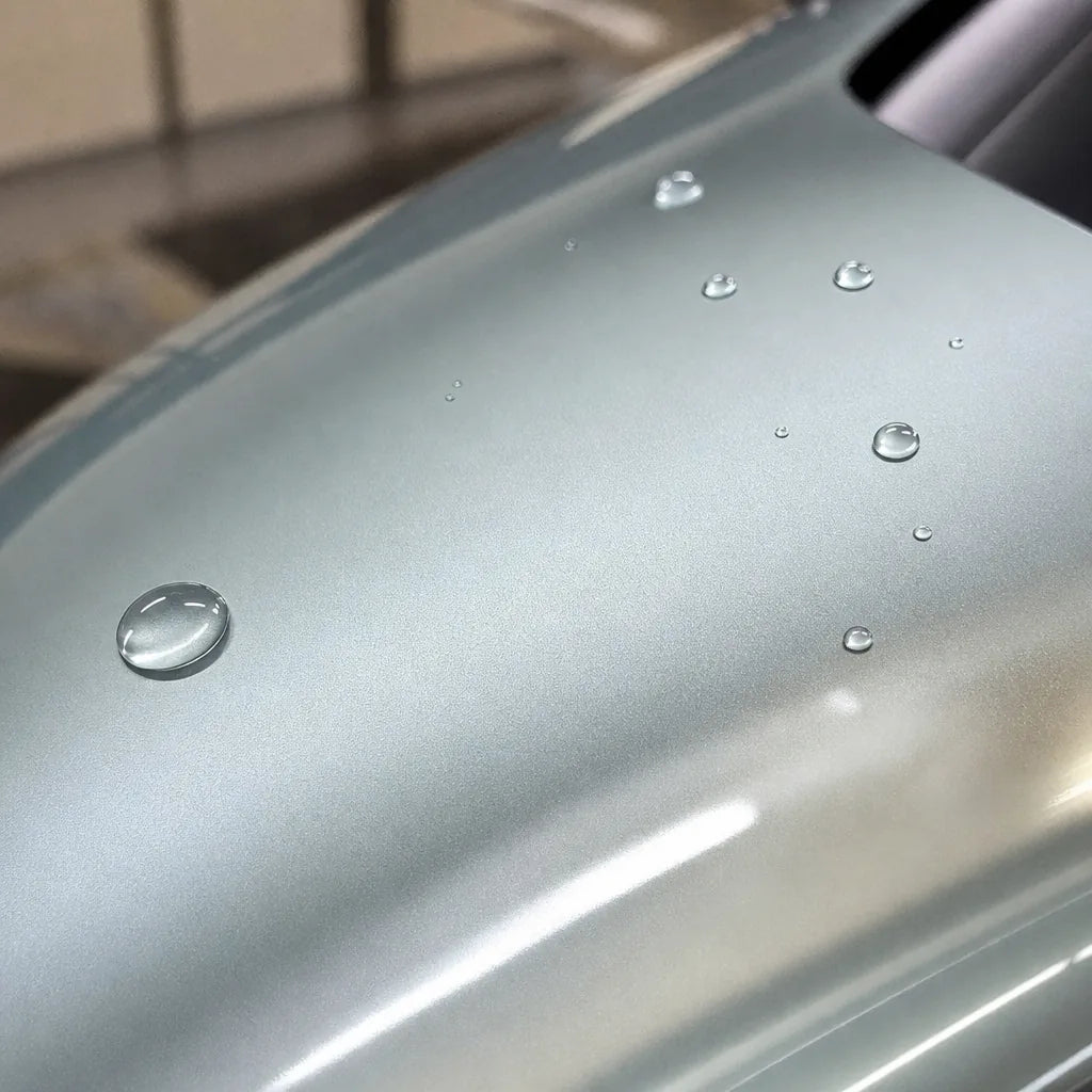 Close-up of Liquid Metallic Titanium Silver gloss colored PPF surface texture | Veloro
