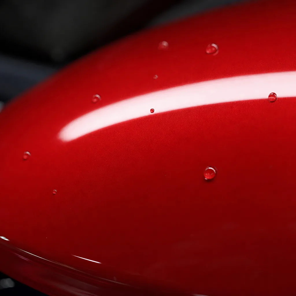 Close-up of Magic Flame Gold Red gloss colored PPF surface texture | Veloro