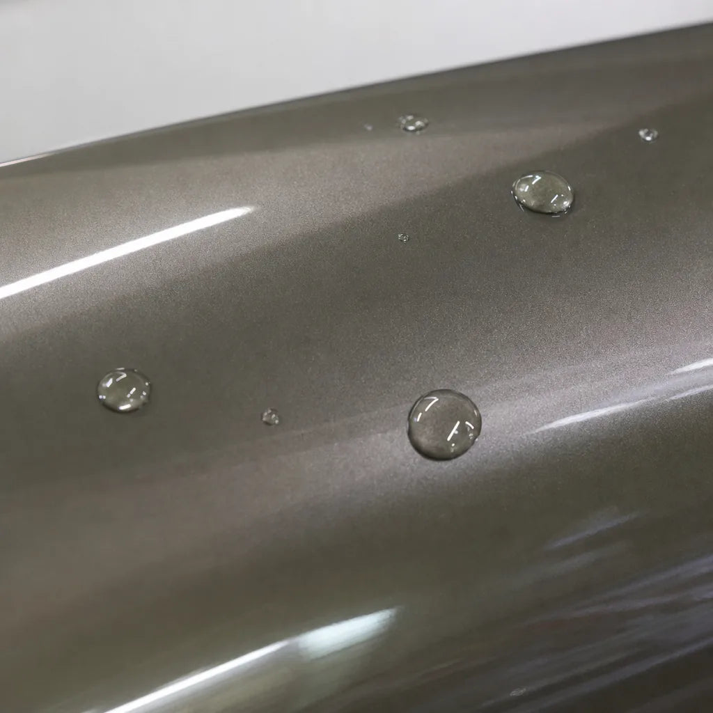Close-up of Metallic Alpine Green gloss colored PPF surface texture | Veloro