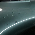Close-up of Metallic Aurora Green gloss colored PPF surface texture | Veloro