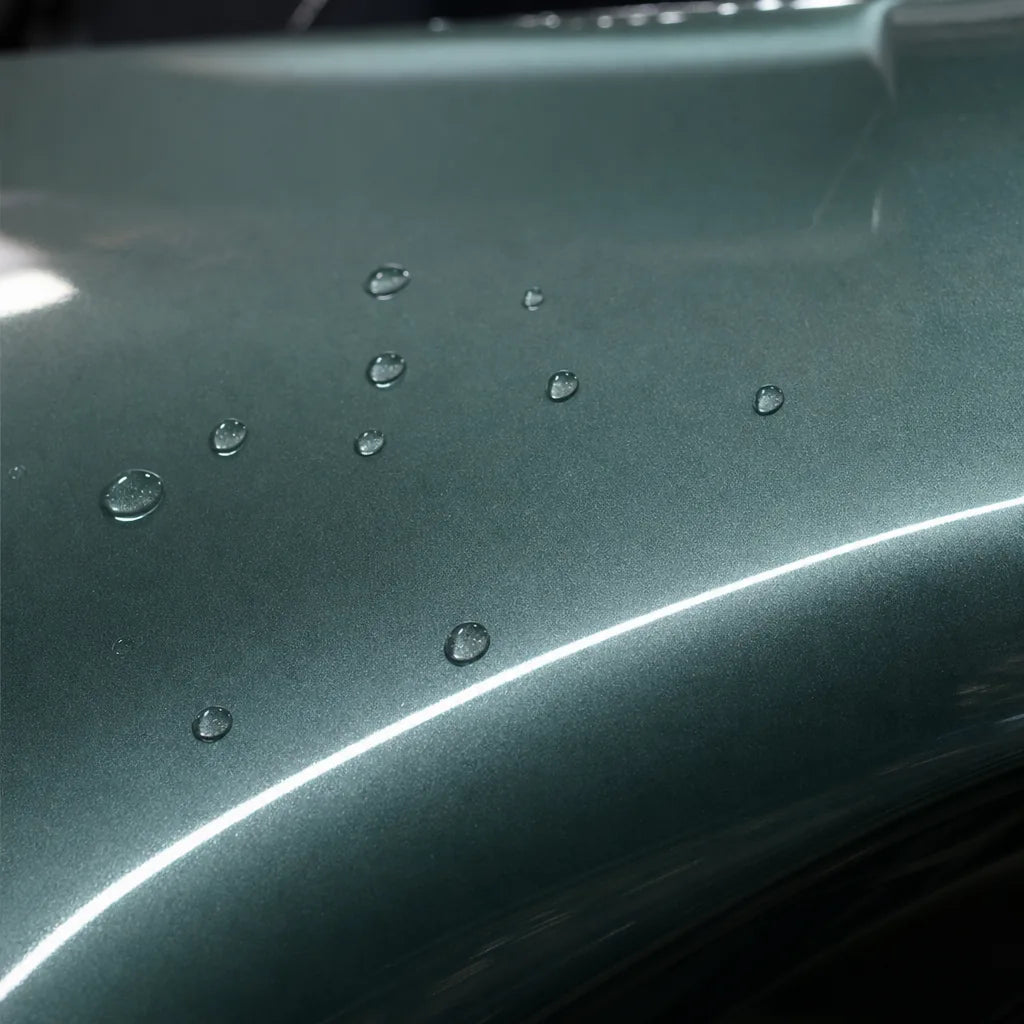 Close-up of Metallic Aurora Green gloss colored PPF surface texture | Veloro