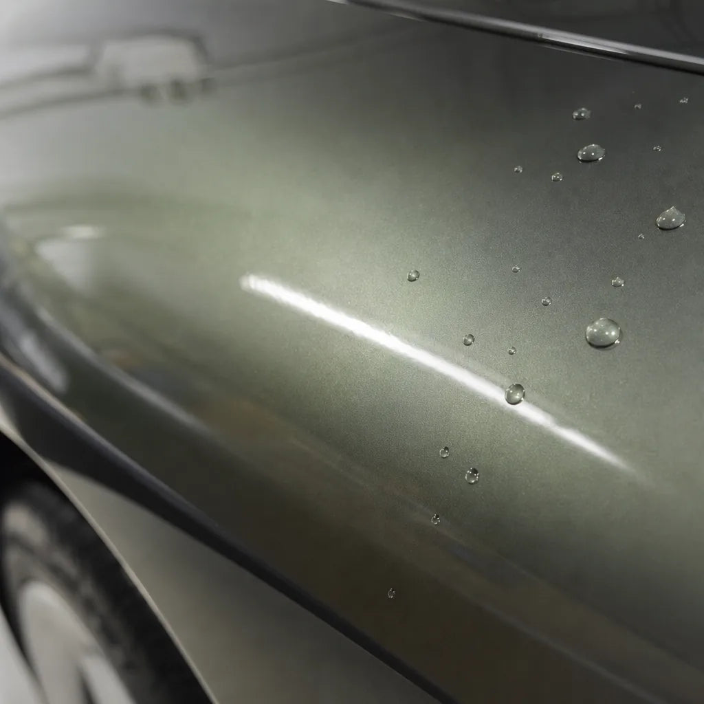 Close-up of Metallic Aventurine Green gloss colored PPF surface texture | Veloro