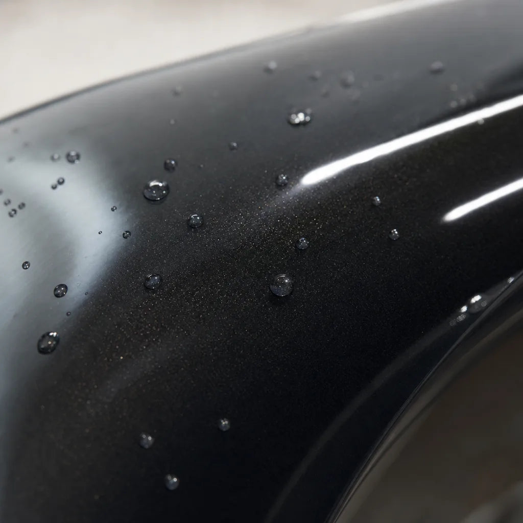 Close-up of Metallic BMW Diamond Graphite Grey gloss colored PPF surface texture | Veloro