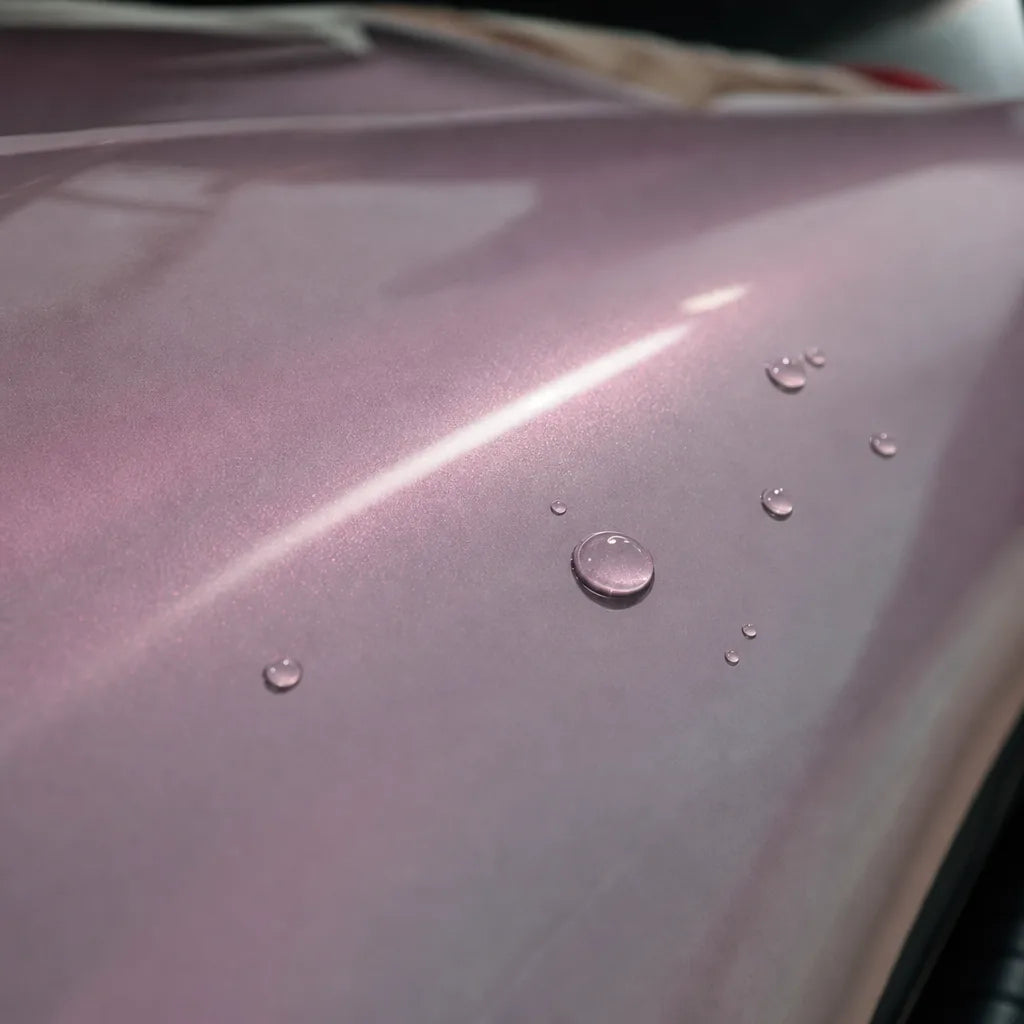 Close-up of Metallic Chameleon Pink gloss colored PPF surface texture | Veloro
