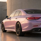 Luxury car wrapped in Metallic Chameleon Pink gloss colored PPF at golden hour | Veloro