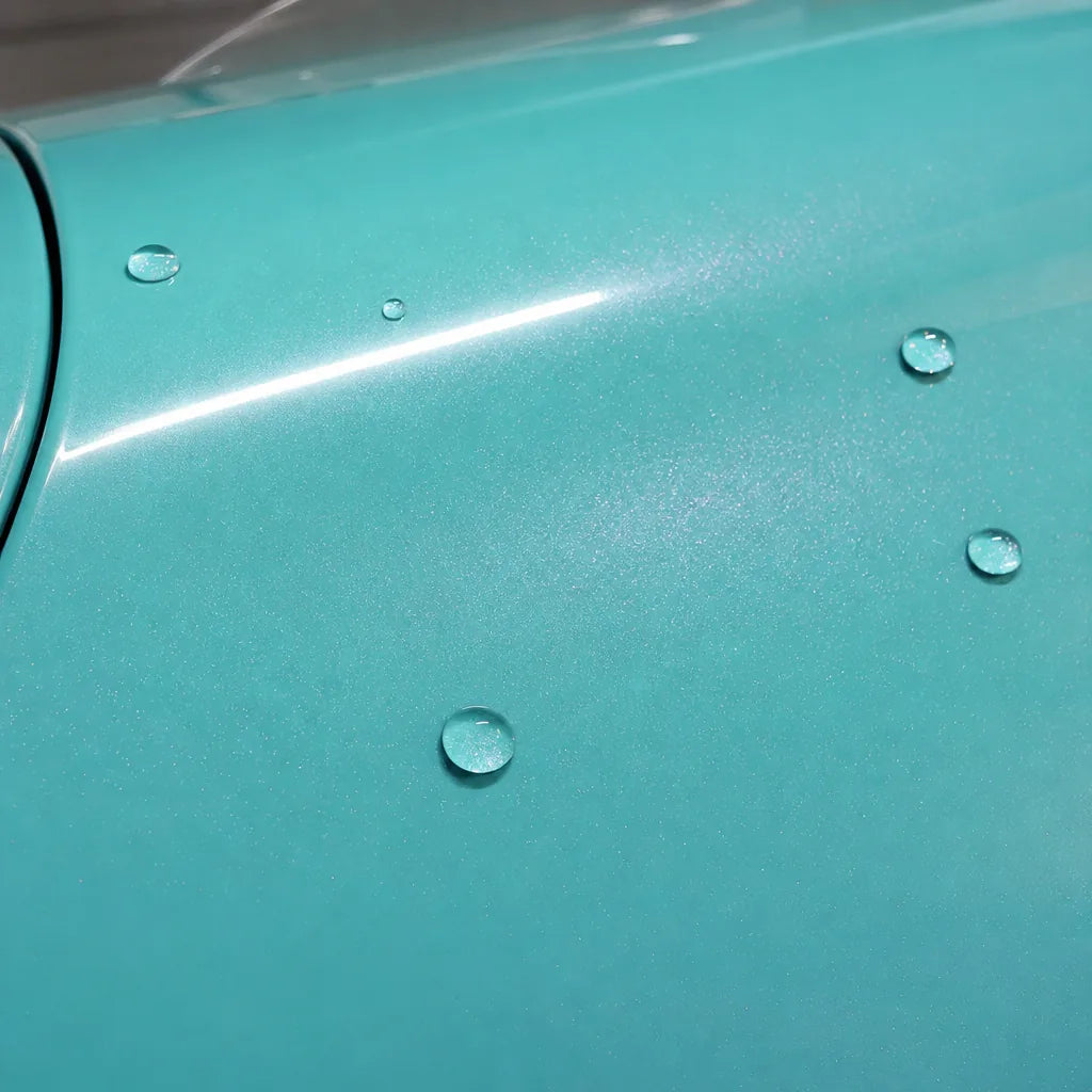 Close-up of Metallic Chameleon Tiffany Pink gloss colored PPF surface texture | Veloro