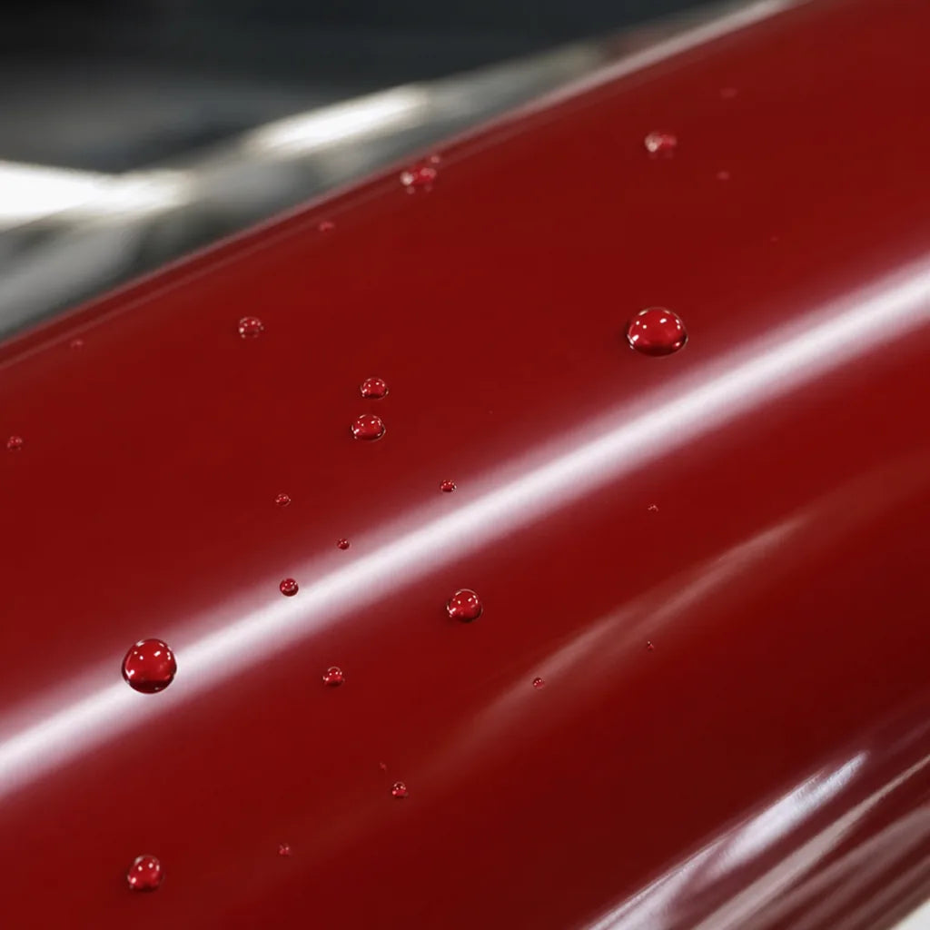 Close-up of Metallic Cherry Red gloss colored PPF surface texture | Veloro
