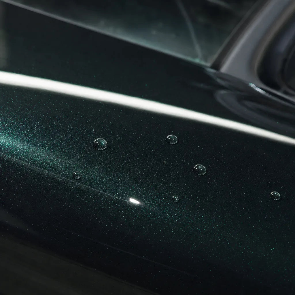Close-up of Metallic Emerald Green gloss colored PPF surface texture | Veloro