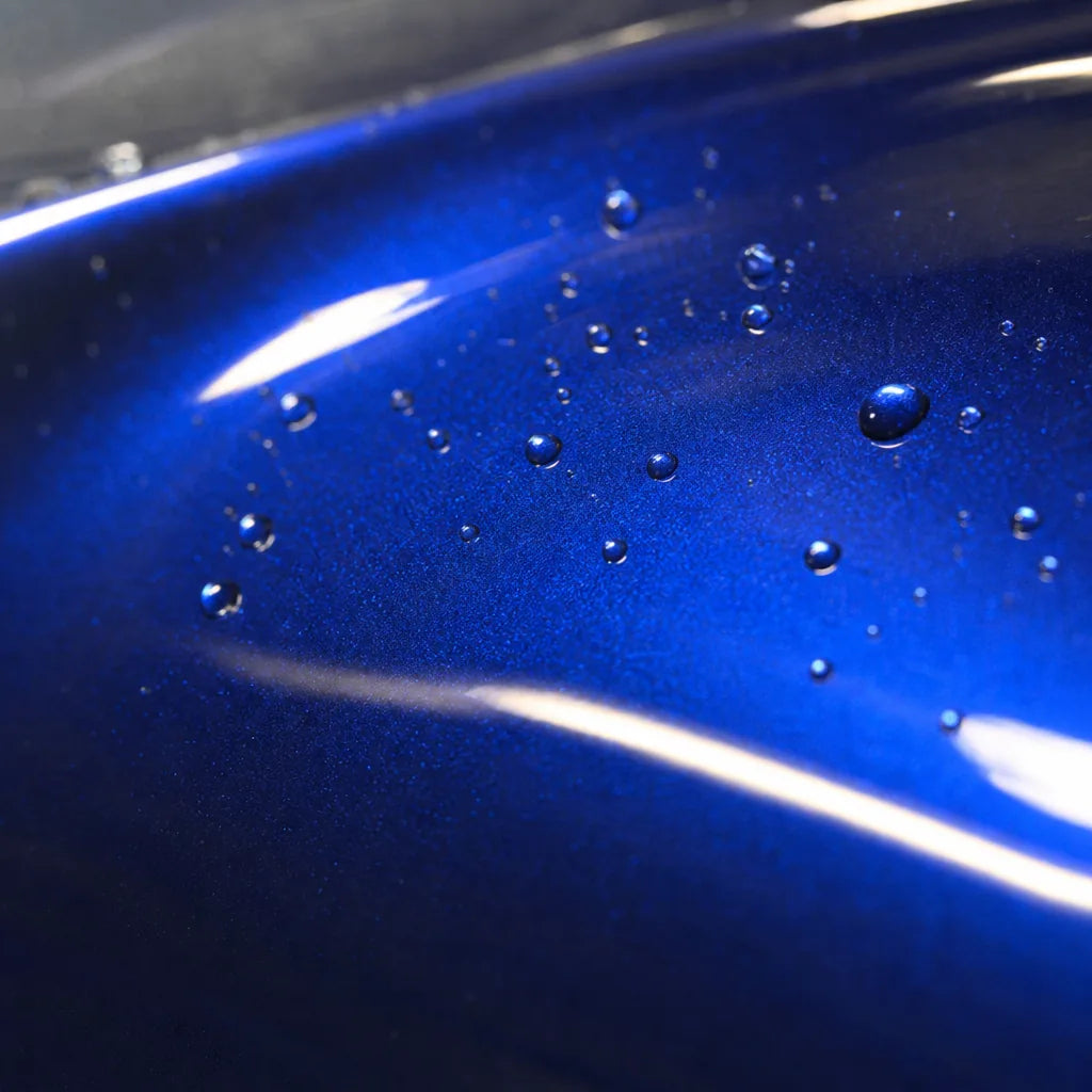 Close-up of Metallic Gentian Blue gloss colored PPF surface texture | Veloro