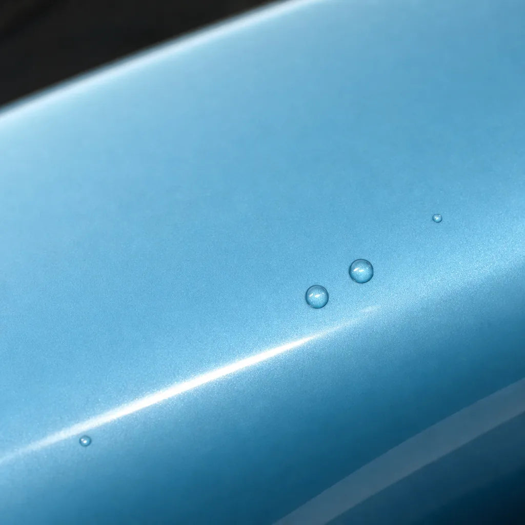 Close-up of Metallic Ice Blue gloss colored PPF surface texture | Veloro