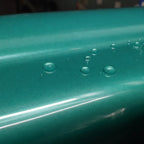 Close-up of Metallic Jade Elegant Green gloss colored PPF surface texture | Veloro