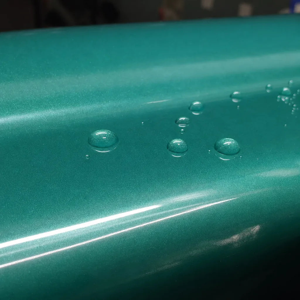 Close-up of Metallic Jade Elegant Green gloss colored PPF surface texture | Veloro
