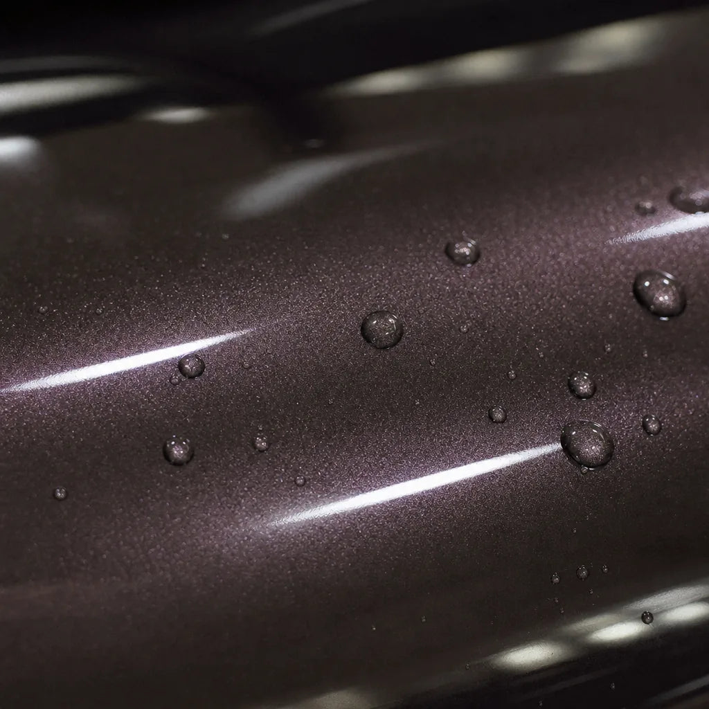 Close-up of Metallic Librae Purple gloss colored PPF surface texture | Veloro