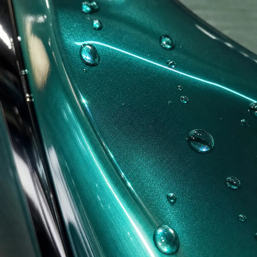Close-up of Metallic Martin Racing Green gloss colored PPF surface texture | Veloro