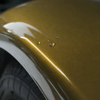 Close-up of Metallic Midnight Gold gloss colored PPF surface texture | Veloro