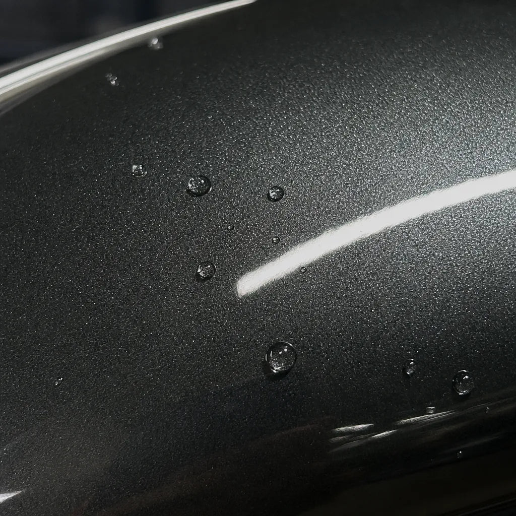 Close-up of Metallic Moonlight Stone Grey gloss colored PPF surface texture | Veloro