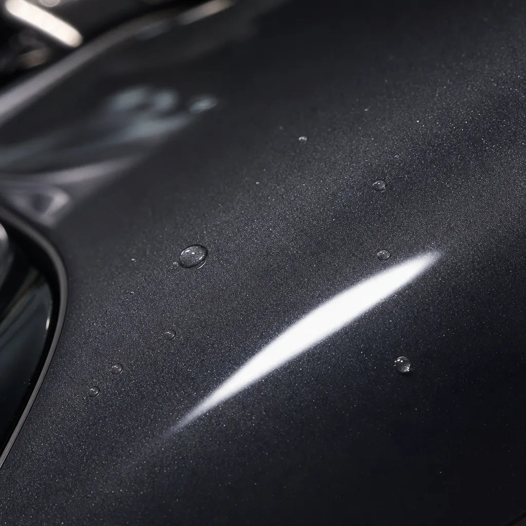Close-up of Metallic Mountain Grey gloss colored PPF surface texture | Veloro