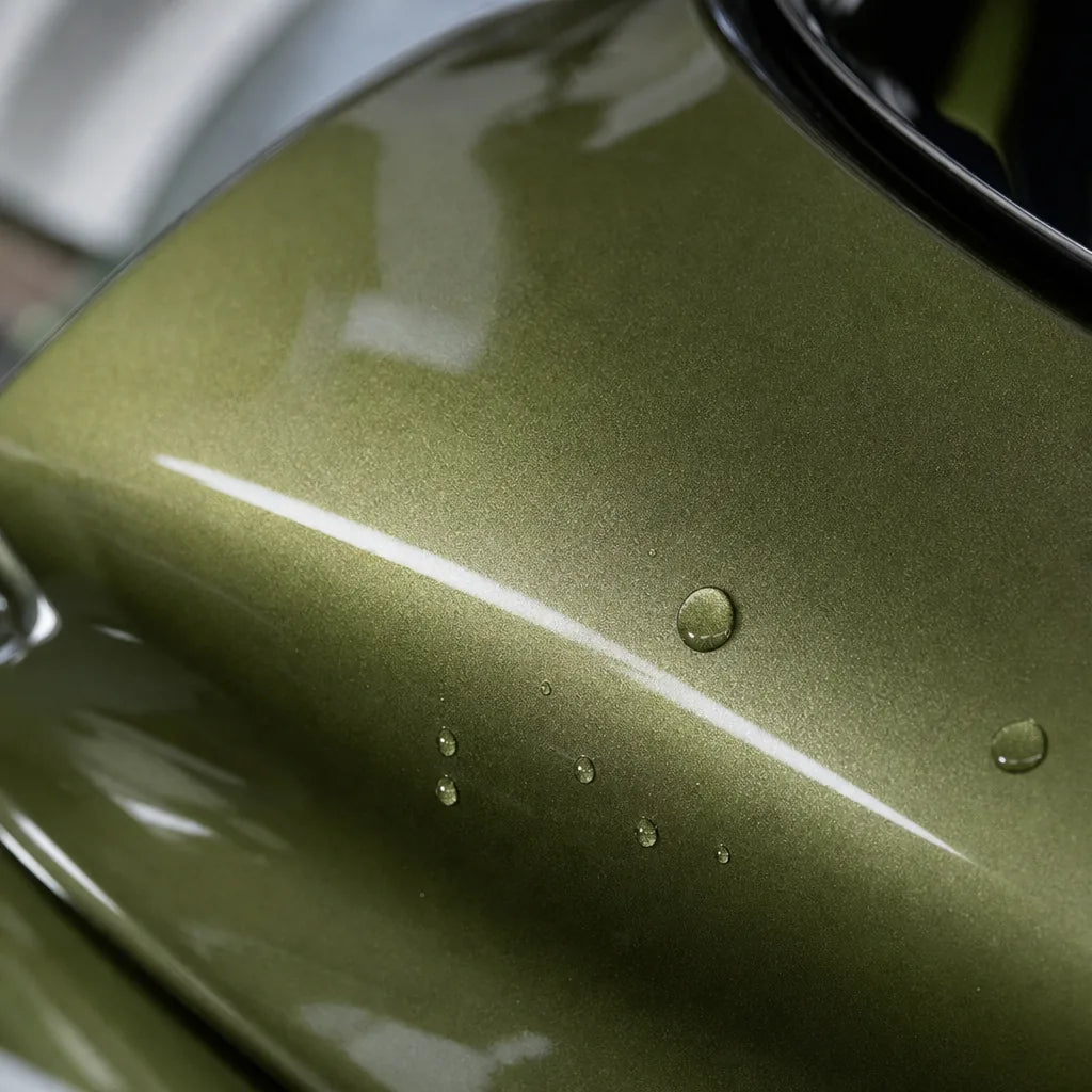 Close-up of Metallic Olive Green gloss colored PPF surface texture | Veloro