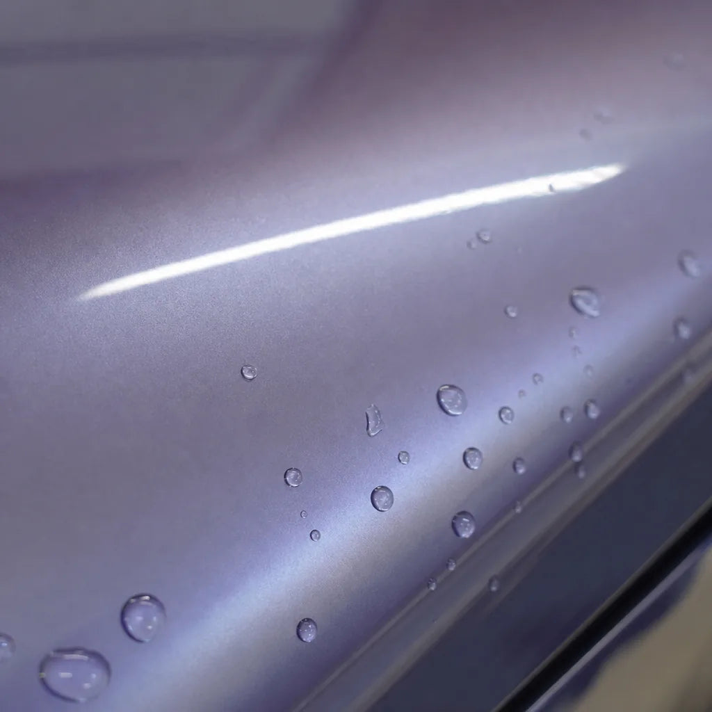 Close-up of Metallic Periwinkle Purple gloss colored PPF surface texture | Veloro