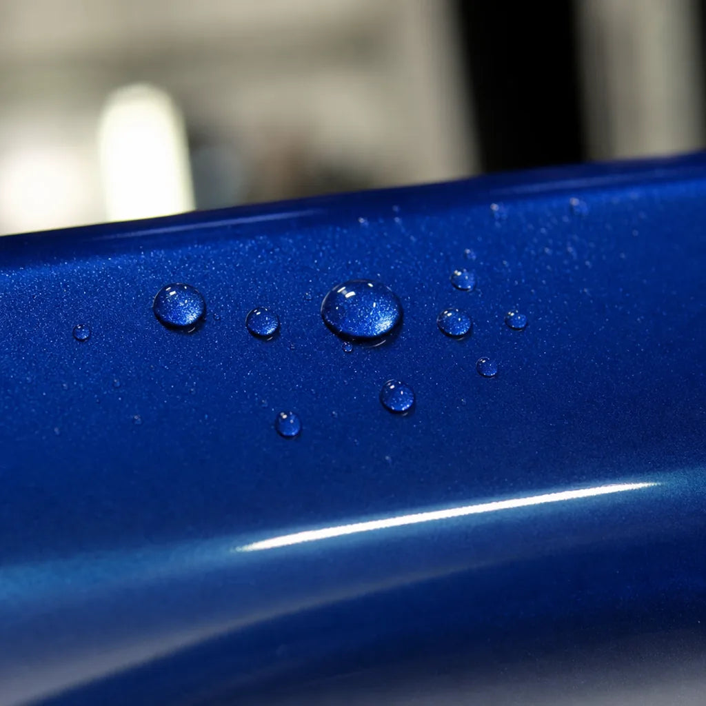 Close-up of Metallic Sepang Blue gloss colored PPF surface texture | Veloro