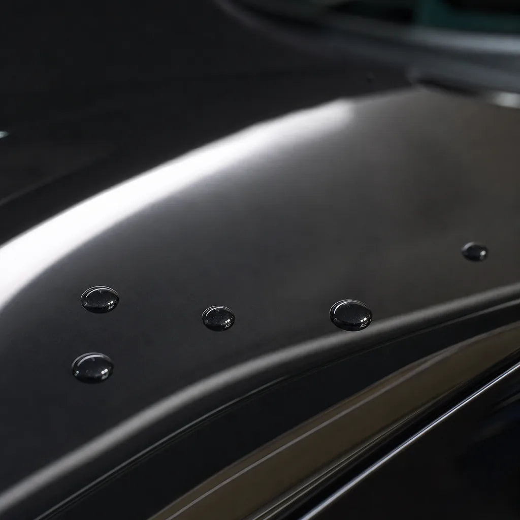 Close-up of Obsidian Black gloss colored PPF surface texture | Veloro