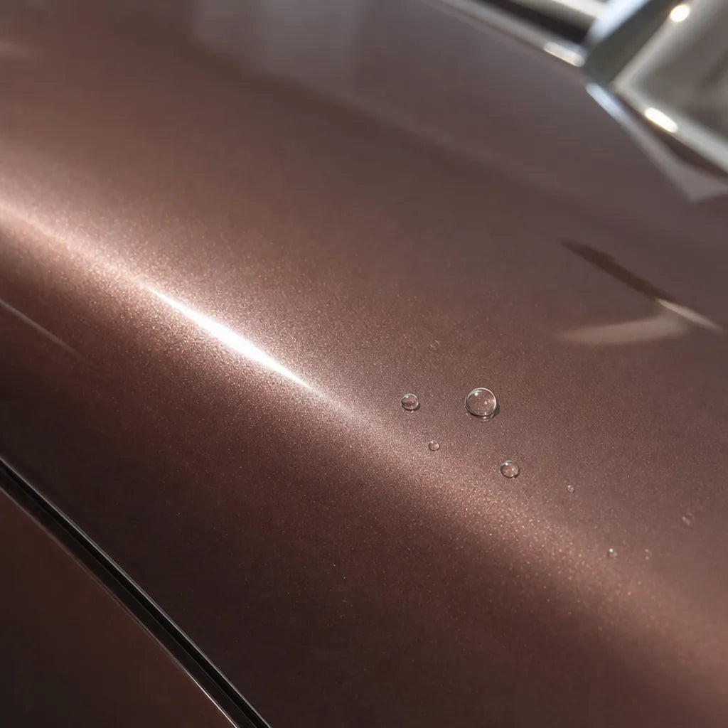 Close-up of Rouge Pearl Pink gloss colored PPF surface texture | Veloro