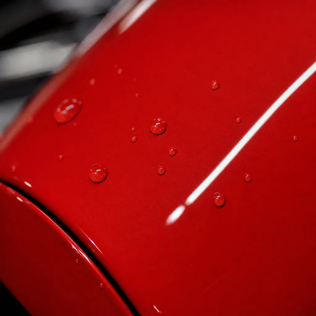 Close-up of Strawberry Red gloss colored PPF surface texture | Veloro