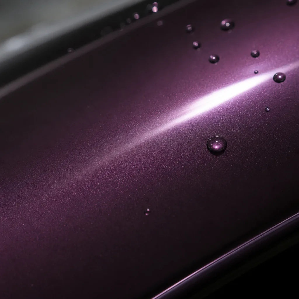Close-up of Super Bright Black Magic Purple gloss colored PPF surface texture | Veloro