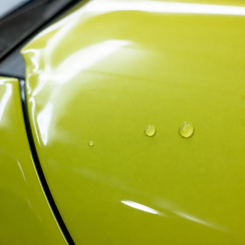 Close-up of Glossy Acid Green gloss colored PPF surface texture | Veloro