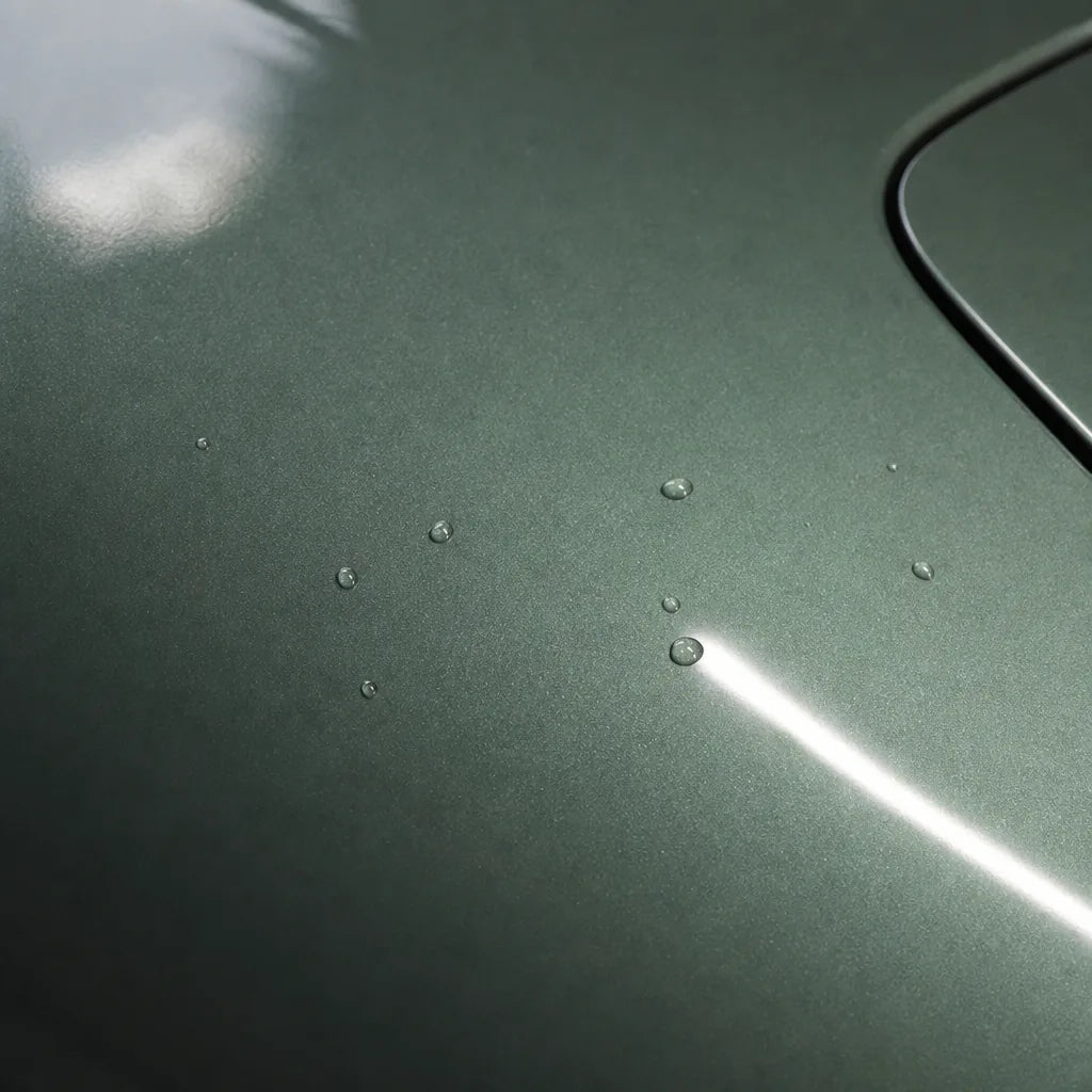 Close-up of Glossy Metallic Francesca Green gloss colored PPF surface texture | Veloro