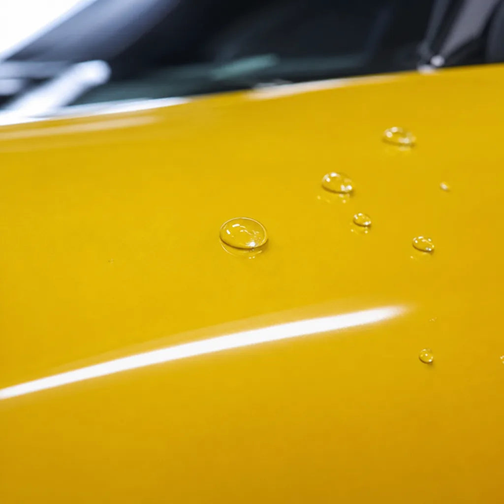 Close-up of Glossy Signal Yellow gloss colored PPF surface texture | Veloro