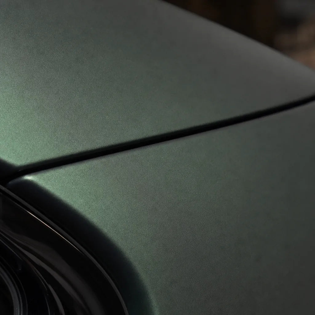 Close-up of Ghost Metallic Dark Green matte colored PPF surface texture | Veloro